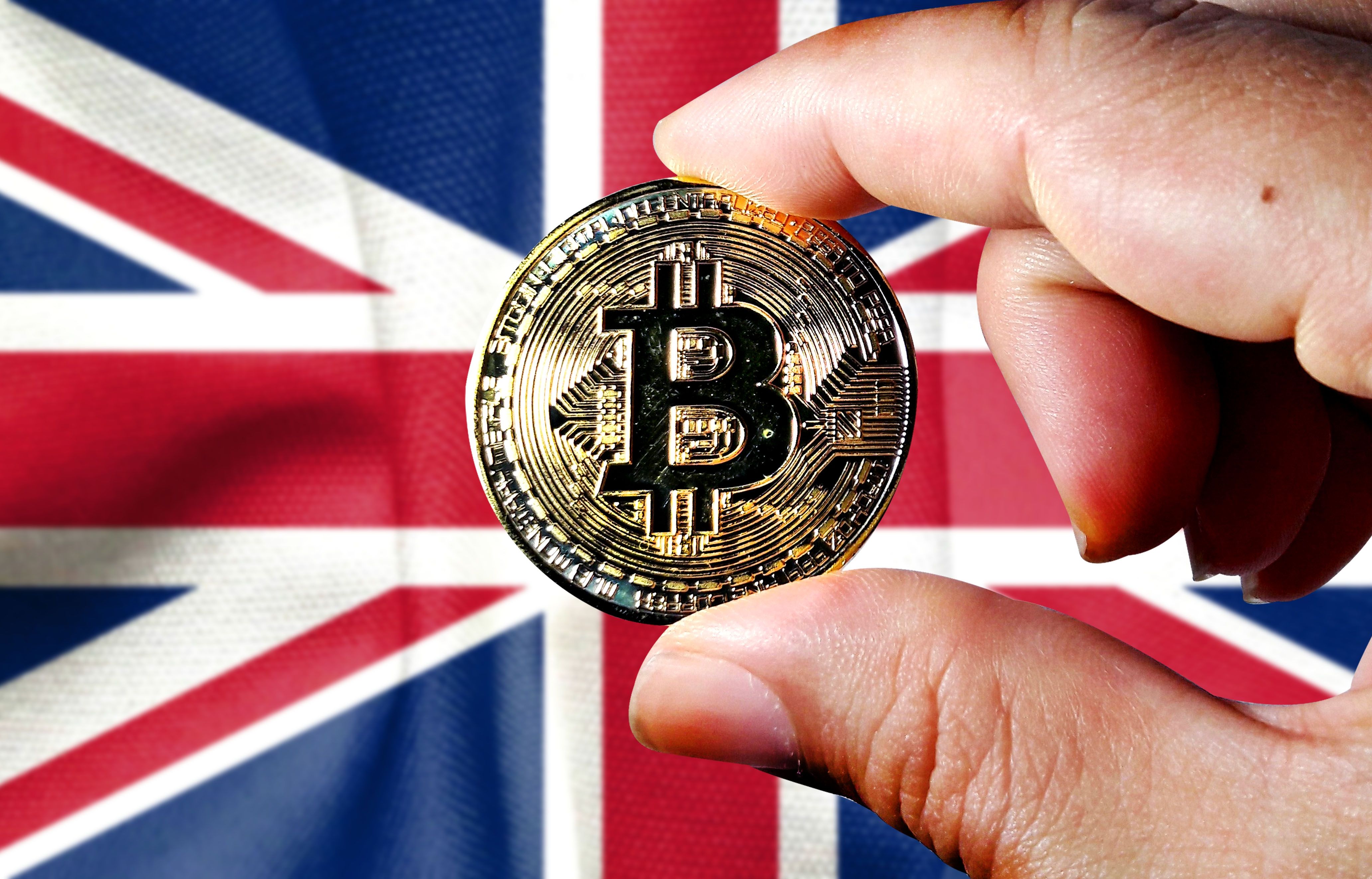 UK flag overlaid with DeFi lending pools and no-gain-no-loss tax icons representing the 2026 HMRC DeFi tax framework for crypto traders